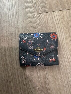 COACH Black Floral Leather Trifold Wallet with Gold Logo